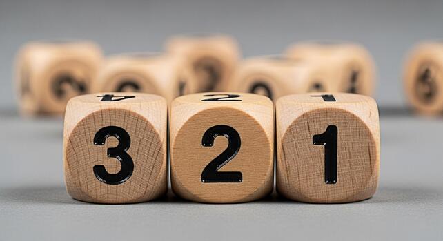 Wooden number blocks displaying a clear 321 countdown sequence on a minimalist gray background symbolizing preparation new beginnings and critical timing for projects photo