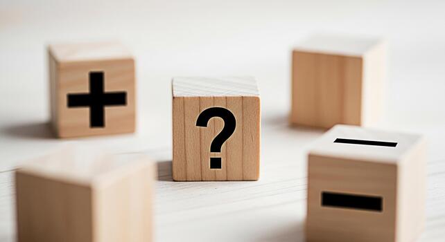 Wooden blocks displaying plus minus and question mark symbols on a clean white surface representing the complex process of evaluating options and making critical decisions photo
