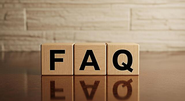 Wooden blocks spelling FAQ clearly displayed on a reflective surface symbolizing frequently asked questions and readily available information for business support and clarity photo