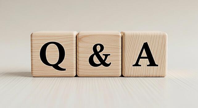 Wooden blocks spelling QA symbolizing inquiry and resolution on a clean background for bus photo