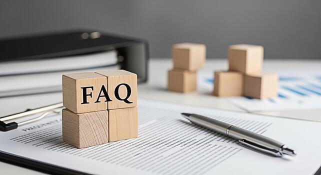 Wooden blocks displaying FAQ on a desk with documents and a pen symbolizing information access and customer service in a professional office environment creating a sense of clarity and support photo