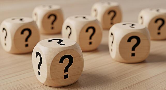 Group of wooden dice displaying question marks on a light wooden surface symbolizing uncertainty and the need for answers in decisionmaking creating a mood of curiosity and exploration photo