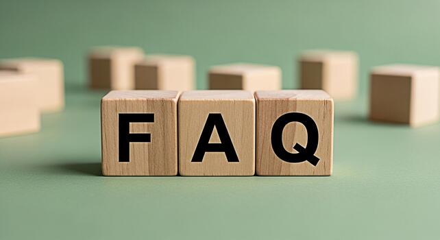 Wooden blocks spelling FAQ on a green surface representing frequently asked questions and providing information in a simple and accessible way conveying clarity and guidance for users seeking answers photo