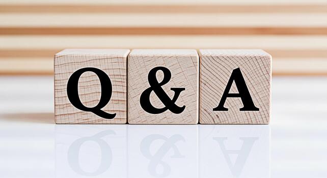 Wooden blocks displaying Q A on a reflective white surface symbolizing questions and answers in a clear and concise presentation ideal for educational content and business communication photo