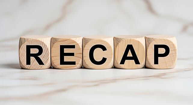 Wooden blocks spelling RECAP on a marble surface summarizing key points and reflecting on past events creating a sense of closure and understanding in a clean and modern setting photo