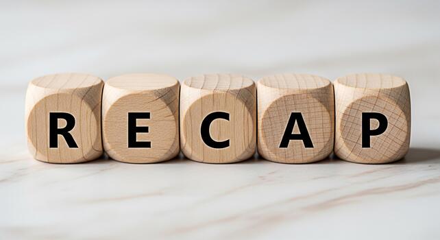 Wooden blocks spelling RECAP on a marble surface representing a summary or review of past events creating a sense of reflection and analysis in a business or educational setting photo