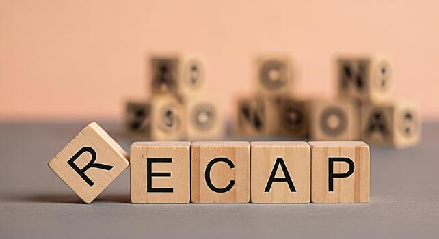 Wooden blocks spelling Recap on a neutral surface symbolizing a summary or review in a business or educational setting conveying a sense of clarity and understanding of key points and achievements photo