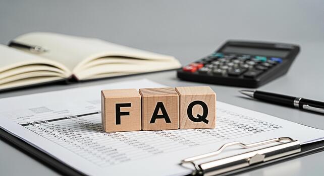 Wooden FAQ blocks resting on a financial document in a bright office setting representing frequently asked questions information resources and customer support with a clean and professional aesthetic photo