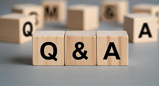 Wooden blocks displaying Q A on a gray surface representing questions and answers knowledge sharing and information exchange in a learning environment fostering curiosity and understanding photo