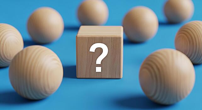 Wooden cube displaying a question mark surrounded by wooden spheres on a blue surface symbolizing uncertainty and the search for answers in a minimalist and conceptual composition photo