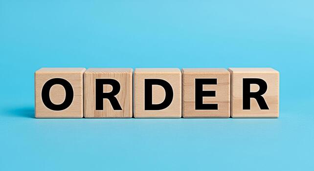 Wooden blocks spelling ORDER on a blue surface representing control and structure in a business environment emphasizing organization and systematic approach to tasks and projects for efficiency and su photo