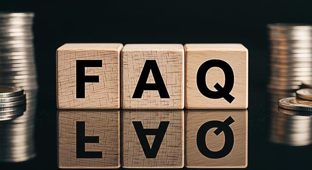 Wooden blocks spelling FAQ with stacked coins on a reflective surface representing financial questions and answers creating a sense of clarity and guidance in financial matters photo