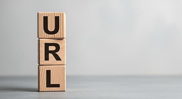 Wooden blocks spelling URL stacked on a gray surface representing internet address and website navigation in a minimalist and clean studio setting conveying a sense of clarity and online presence photo