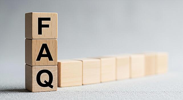 Wooden blocks displaying FAQ in a bright studio setting representing frequently asked questions and providing answers symbolizing help support and information access for customers and users photo