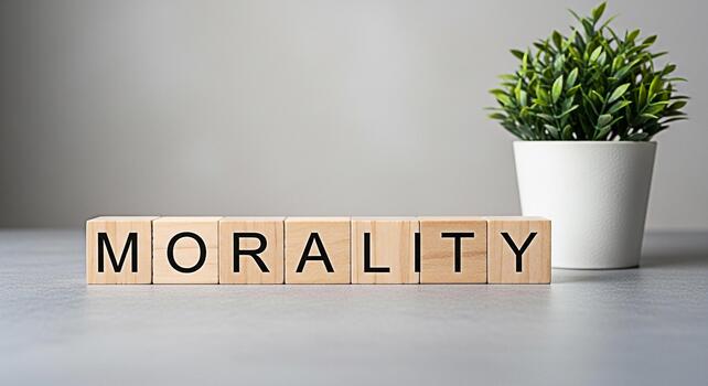 Wooden blocks spelling Morality resting on a gray surface in a minimalist setting symbolizing ethics principles and the importance of moral values in decisionmaking and personal integrity photo