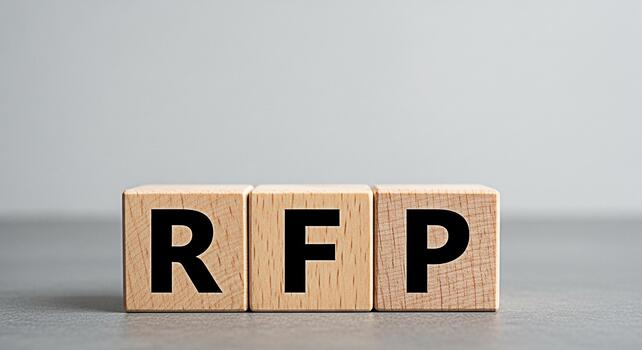 Wooden blocks displaying RFP on a neutral surface symbolizing a request for proposal in a business setting conveying a sense of formality and strategic planning for project procurement photo