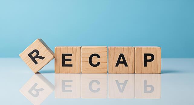Wooden blocks spelling RECAP on a reflective surface against a blue background symbolizing a summary of events and a fresh start with a focus on review and analysis for business and personal growth photo