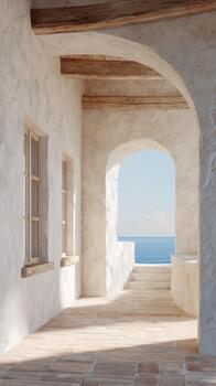 Mediterranean-Style Corridor With Ocean View Through Archway. Tranquil Coastal Architecture And Serene Atmosphere photo