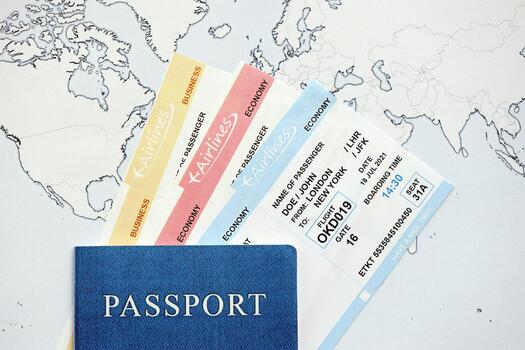 Generic Passport and boarding pass tickets on world map close up. Concept of travel and tourism photo