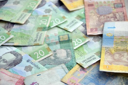 Many different types of currency are scattered on the table photo