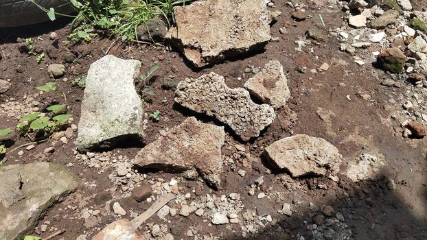 Detailed photos of natural stones and dry soil with random patterns, natural bright lighting, useful for AI computer vision training.