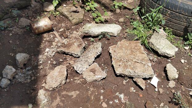 Macro photography of a weathered concrete structure with micro-holes, under daylight lighting. Suitable for AI texture classification. photo