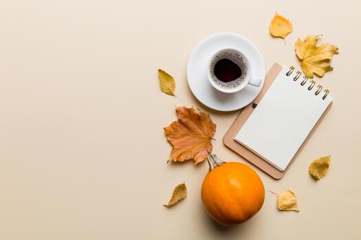 Autumn composition fallen leaves notebook mock up on colored background. Flat lay copy space photo