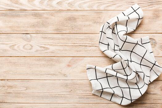 top view empty kitchen napkin isolated on table background. Folded cloth for mockup with copy space, Minimal style photo