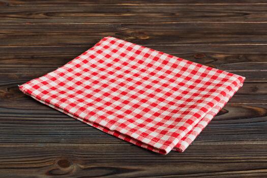 top view red empty kitchen napkin isolated on table background. Folded cloth for mockupe, Minimal style photo