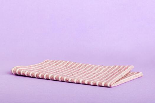 top view empty kitchen napkin isolated on table background. Folded cloth for mockup with copy space, Flat lay. Minimal style photo