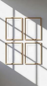 cuatro vacío dorado imagen marcos arreglado en un 2x2 cuadrícula en un blanco muro, bañado en dramático luz de sol y sombra patrones foto