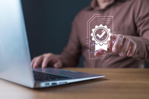 A businessman interacts with a glowing digital icon of a certificate featuring a checkmark, symbolizing quality assurance and trust in digital standards, service, or performance. photo