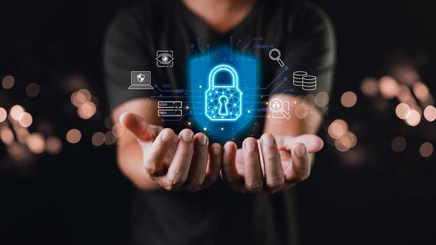 A person holds out their hands beneath a glowing digital padlock surrounded by icons, symbolizing cyber protection, data encryption, security layers, and privacy in a connected digital world. photo