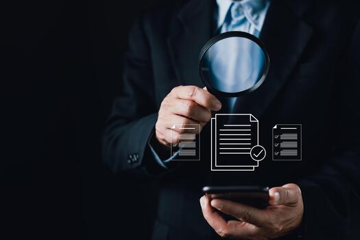 A businessman uses a magnifying glass and smartphone while digital document icons appear, symbolizing certificate validation, quality assurance, trust verification, and secure documentation processes. photo