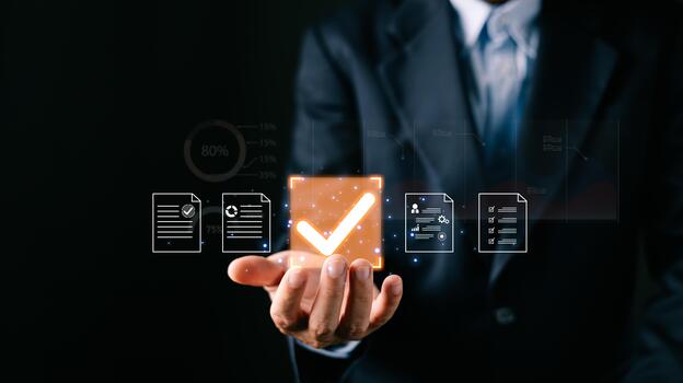 A businessman professional holds a glowing digital certificate document icons, a large checkmark symbolizing digital approve processes, focusing on business quality assurance and data management. photo