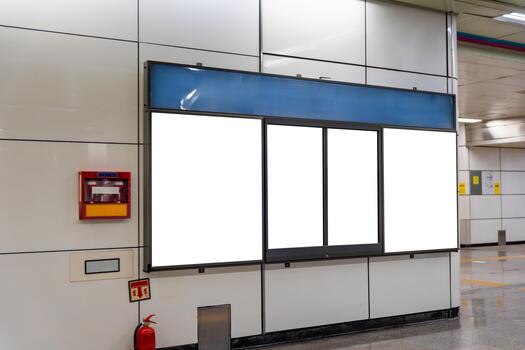 Vertical blank billboard mockups in a subway station platform or underground walkway, Empty advertising panel with multiple screens on white wall in public transit area photo