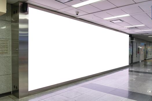 Blank advertising screen on white wall in public transport area, Copy space for marketing message display, Empty digital billboard mockup in subway station or underground train platform photo