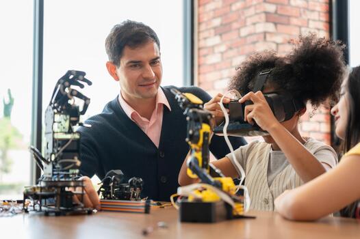 Teacher and Student Exploring Virtual Reality in a STEM Class, Young Girl Holding VR Headset While Learning Robotics and Technology, Technology in Education photo