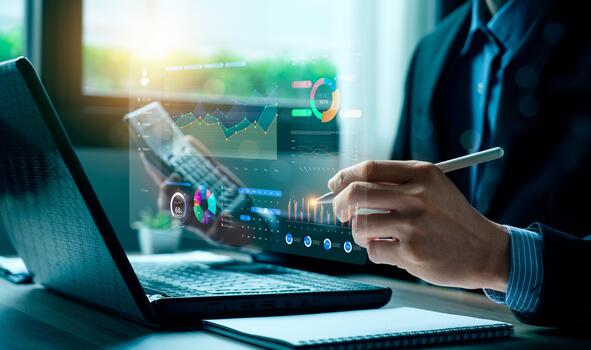 Business professional analyzing digital data dashboard with futuristic charts on laptop, representing financial analytics, business intelligence, digital transformation, data-driven decision making. photo