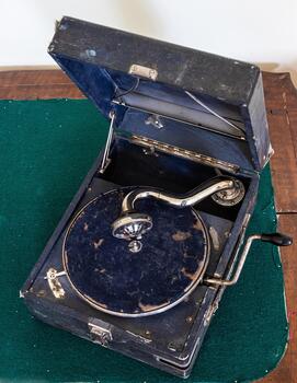 Old broken gramophone retro vintage music player not in use nostalgic background photo