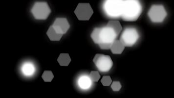 resumen hexagonal bokeh luces flotante en oscuro fondo, movimiento gráficos antecedentes video