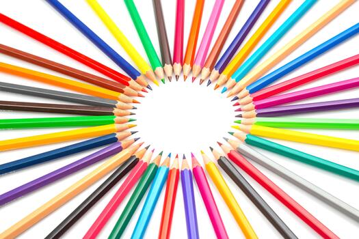the a Multicolored pencils arranged in a circular pattern against a white backdrop, forming a central frame. Ideal for artistic projects, school supplies, or creative design concepts. photo
