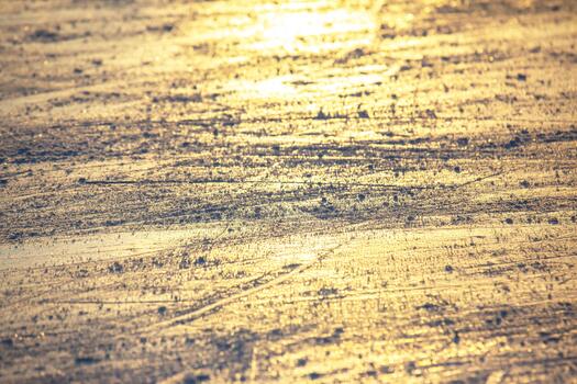 bright traces of ice skating on an ice rink. background and texture. reflection in the sunlight photo