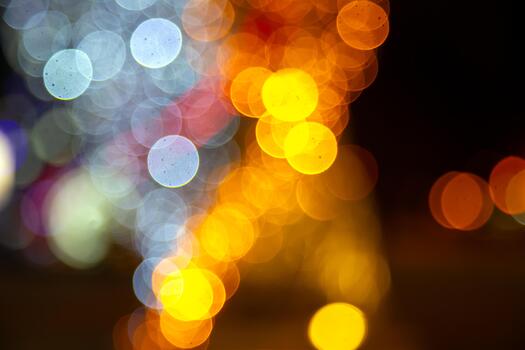 bokeh pattern of golden and colorful lights on a dark background, suitable for holiday or romantic visuals with a soft glow. photo