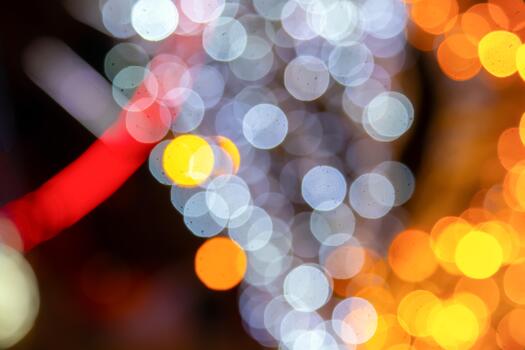 The A magical bokeh pattern of golden and colorful lights on a dark background, suitable for holiday or romantic visuals with a soft glow. photo
