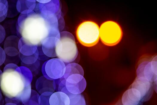 The A bokeh effect with golden and multicolored lights on a dark background, ideal for holiday or dreamy compositions with a glow. photo