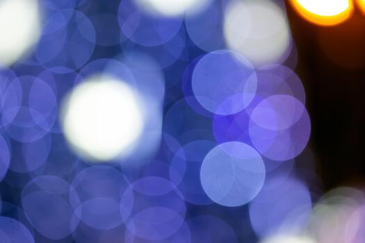 The A mesmerizing bokeh effect with golden and multicolored lights on a dark background, ideal for holiday or dreamy compositions with a glow. photo