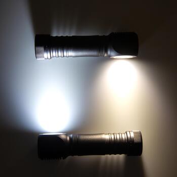 Exploring the functionality and design of two flashlights in different lighting conditions photo
