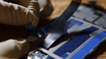 Preparing to replace the broken screen of a smartphone with a new screen video