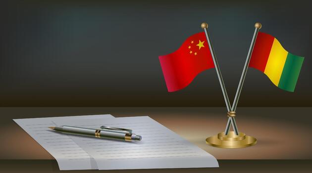 China and Guinea flags on table in office. International relations on a dark gradient color background. vector